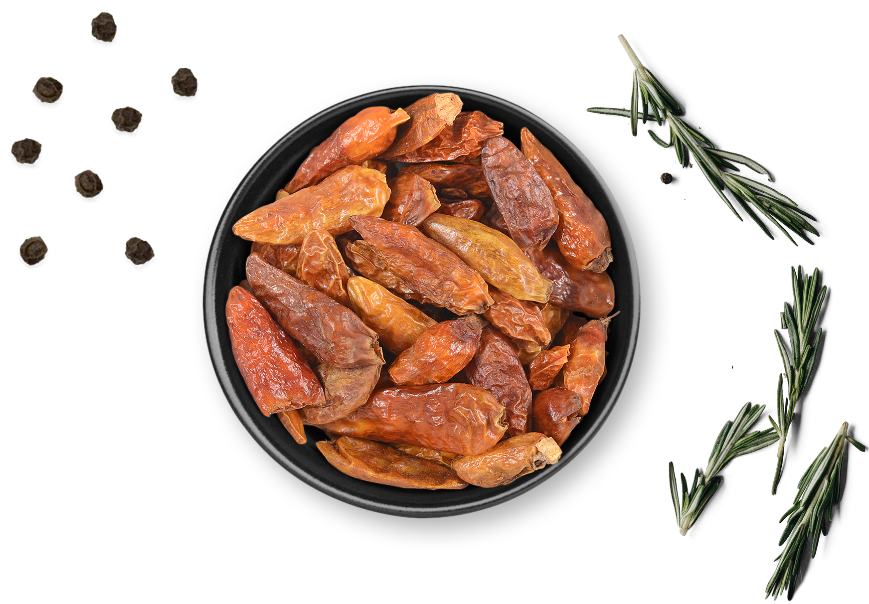 Dosis Rosemary & Co. Gewürze Bird's Eye Chili, daneben schwarze Pfefferkörner, Rosmarin, Knoblauch