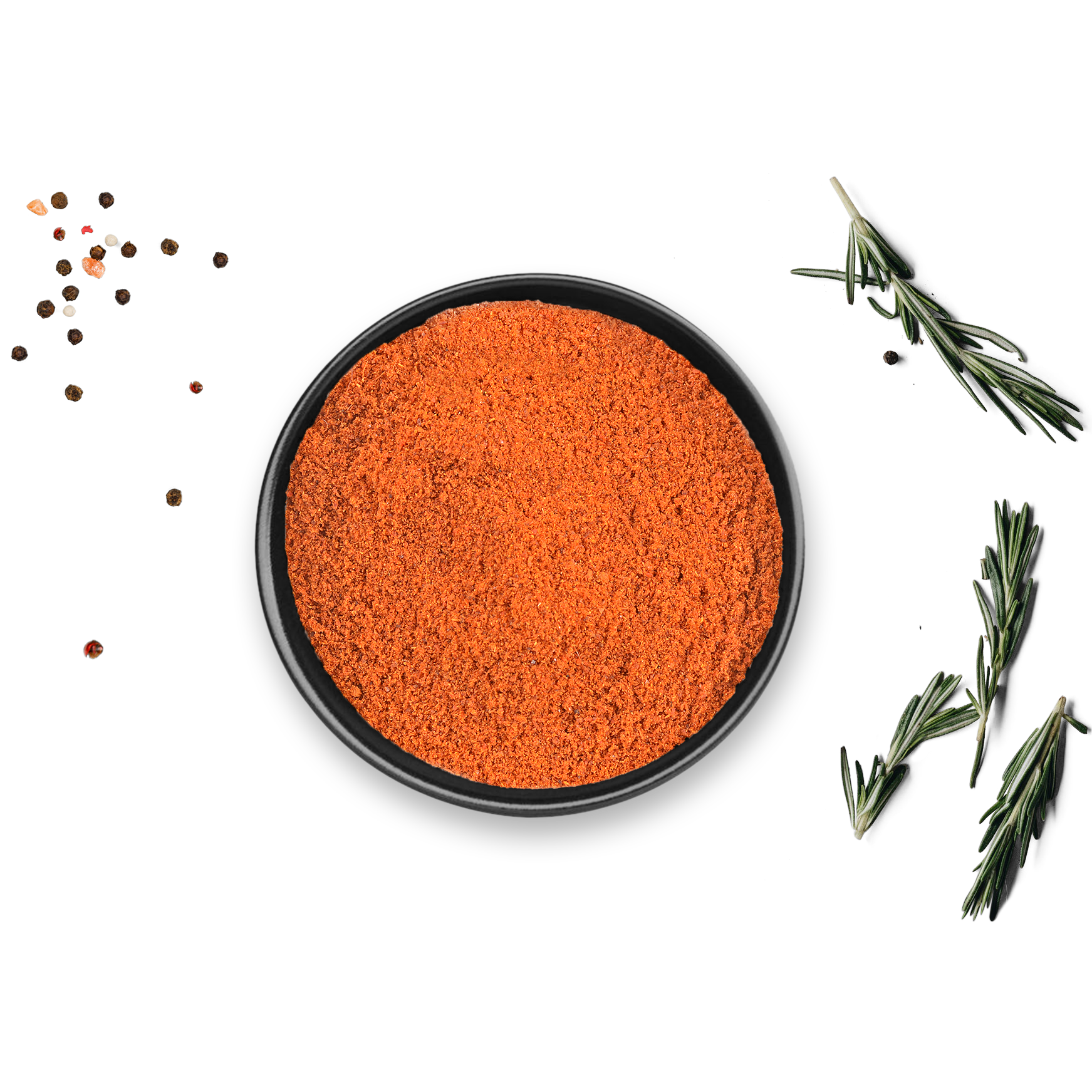 Schwarze Schale mit Bio Paprika Scharf Dose von Rosemary & Co Gewürze, daneben Rosmarinzweige und Pfefferkörner